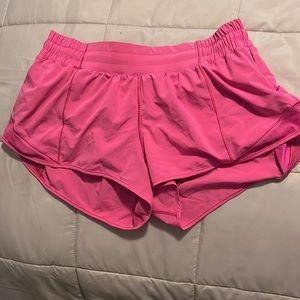 These are Lululemon bitty hots in the color sonic pink. (Size 10)